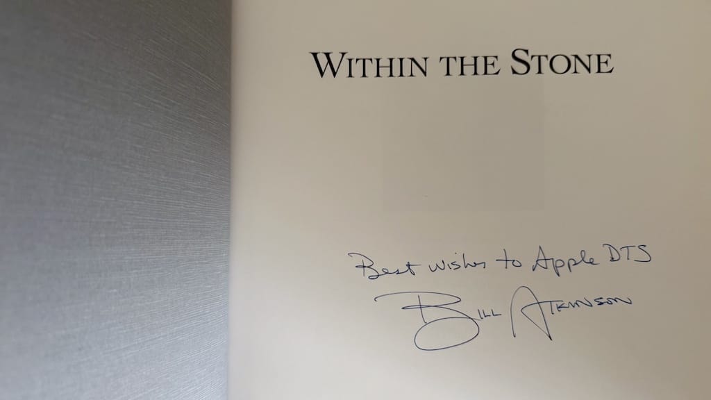 Photo of title page of Bill Atkinson’s book, “Within the Stone”, signed by the author with the inscription “Best Wishes to Apple DTS”.