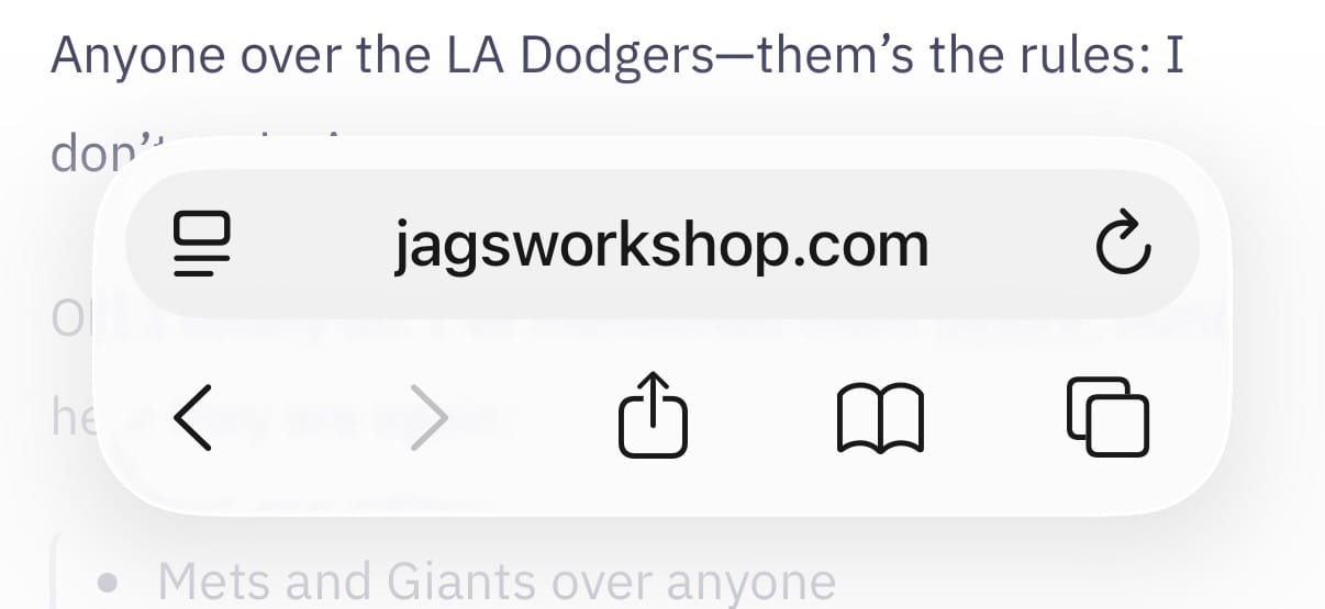 Screenshot of Safari on iOS 26 showing the “Bottom” Tab option, with a URL field, and navigation and other buttons immediately available.